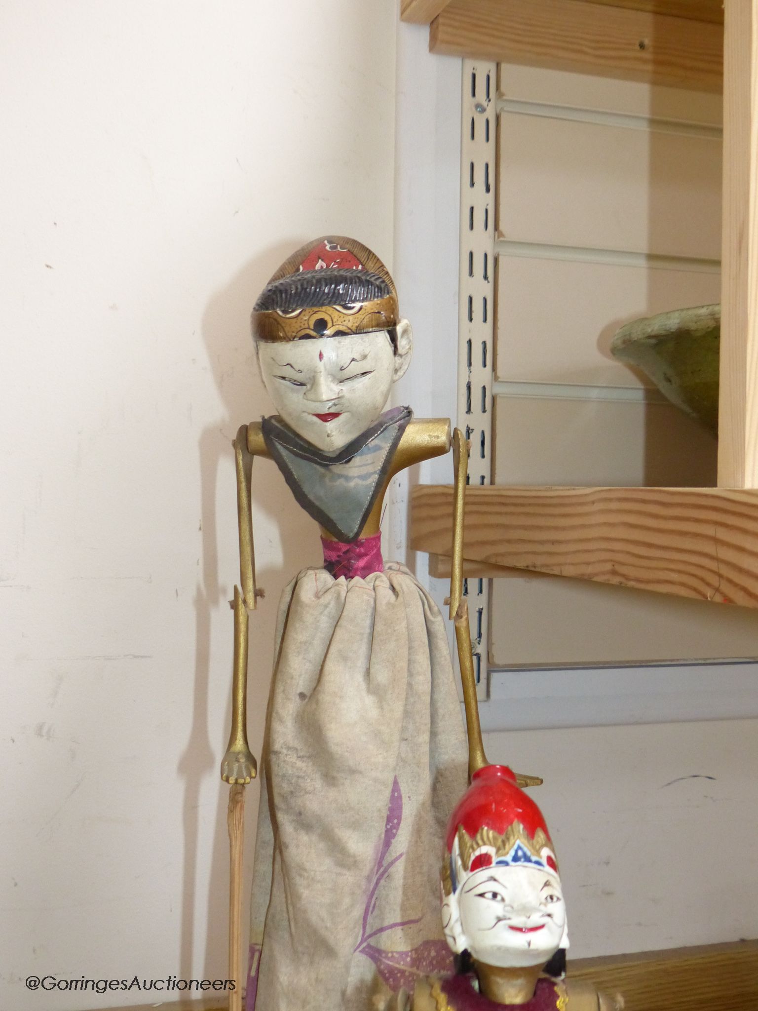Three Indonesian stick puppets and another framed puppet, tallest 59cm